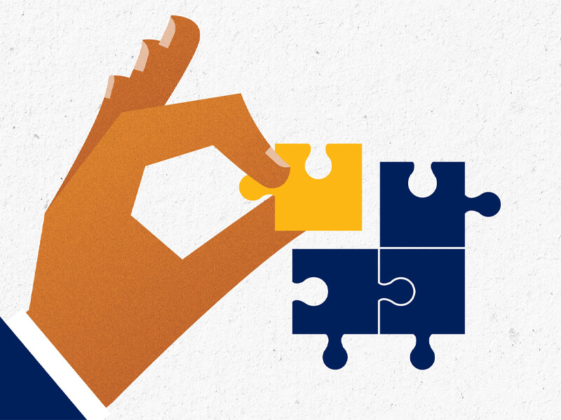 hand placing puzzle piece into place illustration
