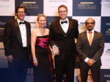 LPL CTO Greg Gates with award, surrounded by LPL’s Vaughn Harvey, Kristie Edling-Day, and Nitesh Ambastha 