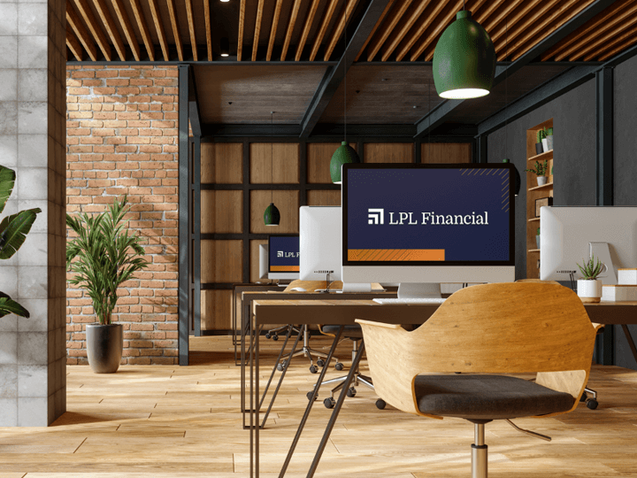 empty desk in office with LPL Financial logo on computer screen